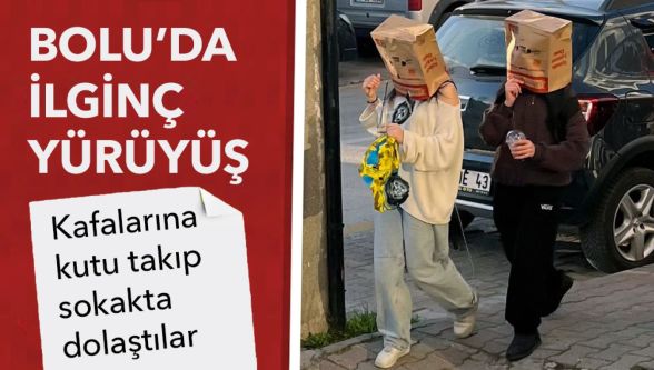 Bolu sokaklarında şaşırtan görüntü: İki genç kız kafalarına kutu geçirerek yürüdü